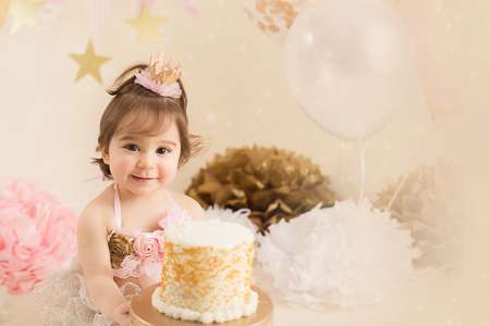 cute happy girl is going smash her birthday cake