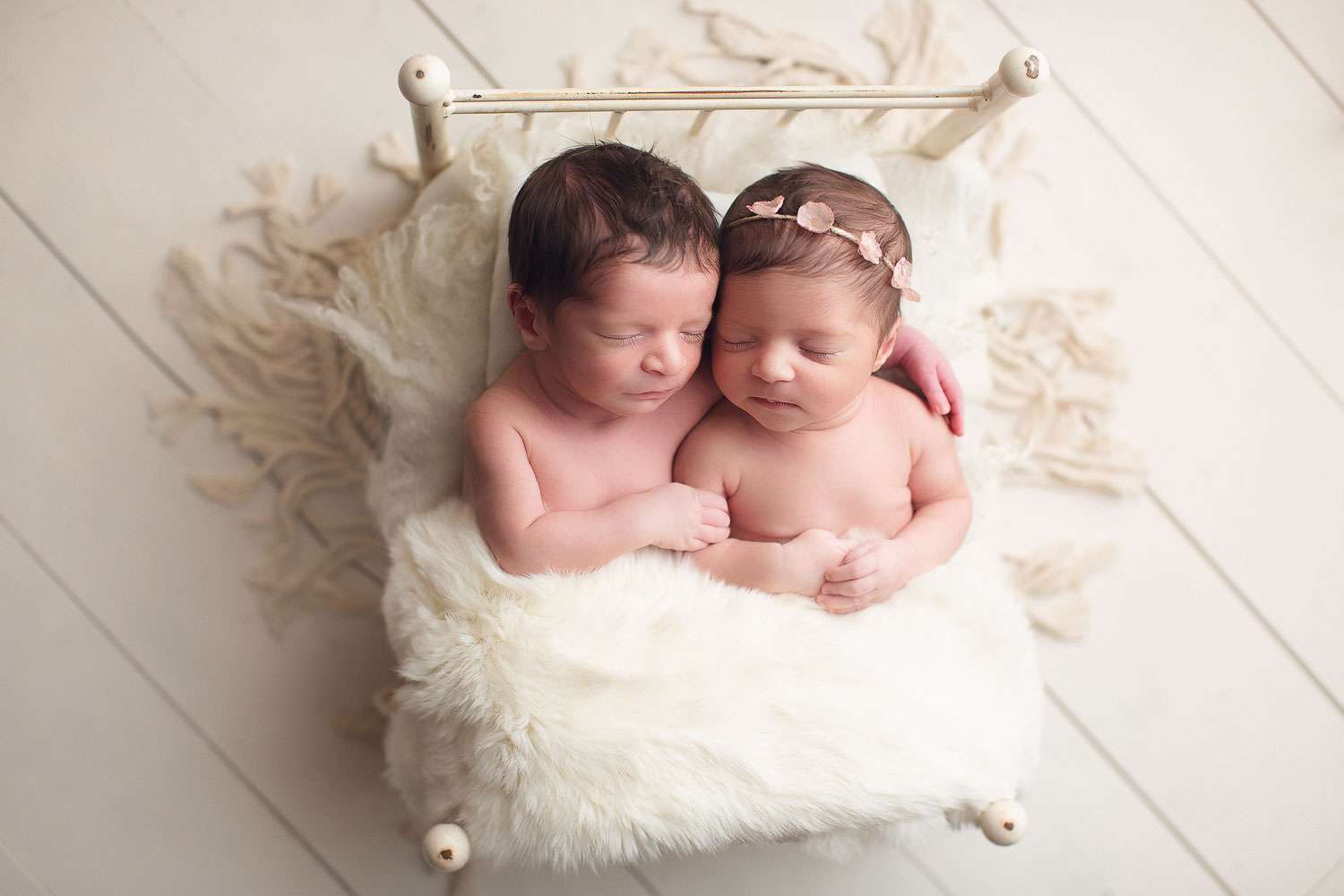 twins newborn siblings boy and girl sleeping in a white bed | Jana photography | vancouver