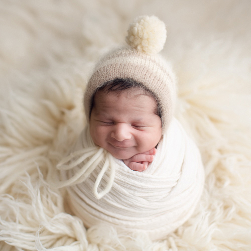 newborn photography Vancouver - baby boy white wrap - smiling 