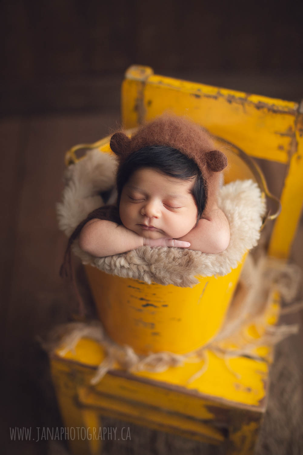 newborn baby boy - yellow bucket - bear hat