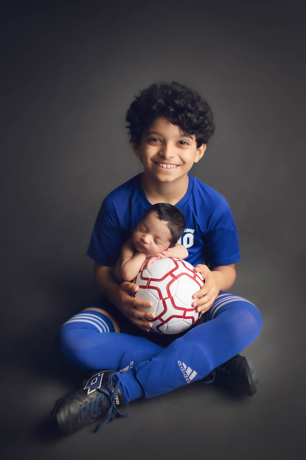 new ideas for newborn photography with soccer ball