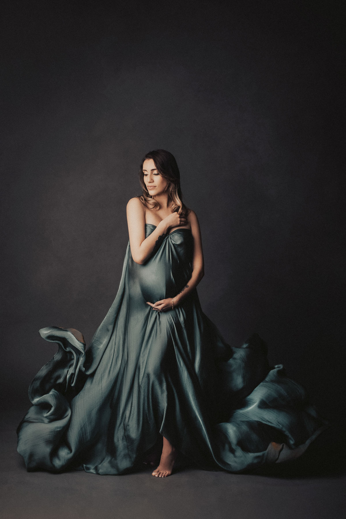 the most beautiful maternity photoshoot with long flying pregnancy gown