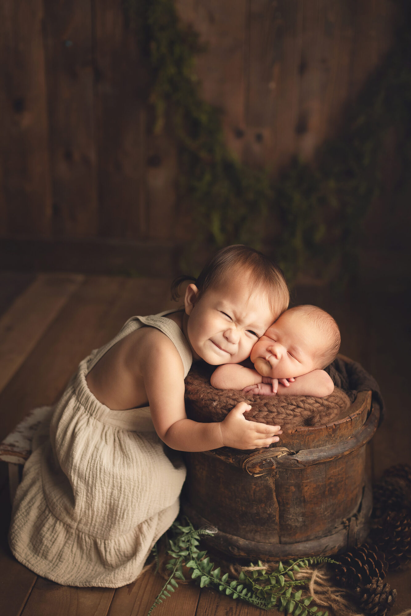 newborn photography baby boy with his sister in a brown bucket - vancouver