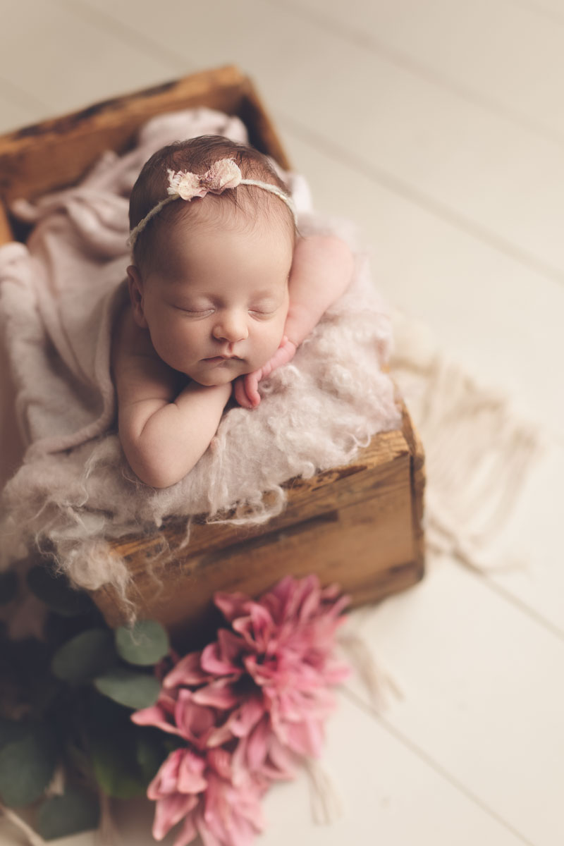 Vancouver - Burnaby and surrey - newborn photography - baby girl sleeping in a brown bed