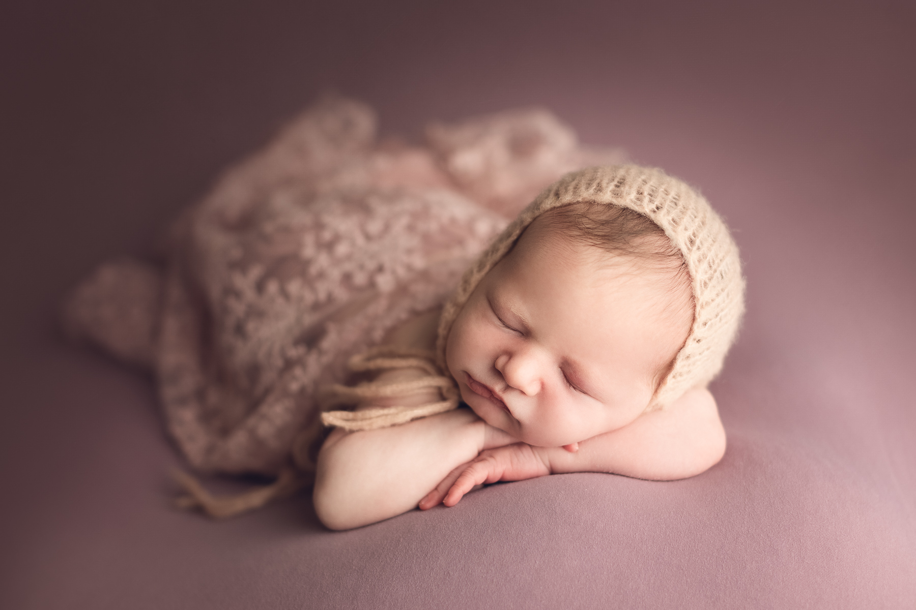 newborn photography classic package sample - baby girl sleeping on a pink fabric