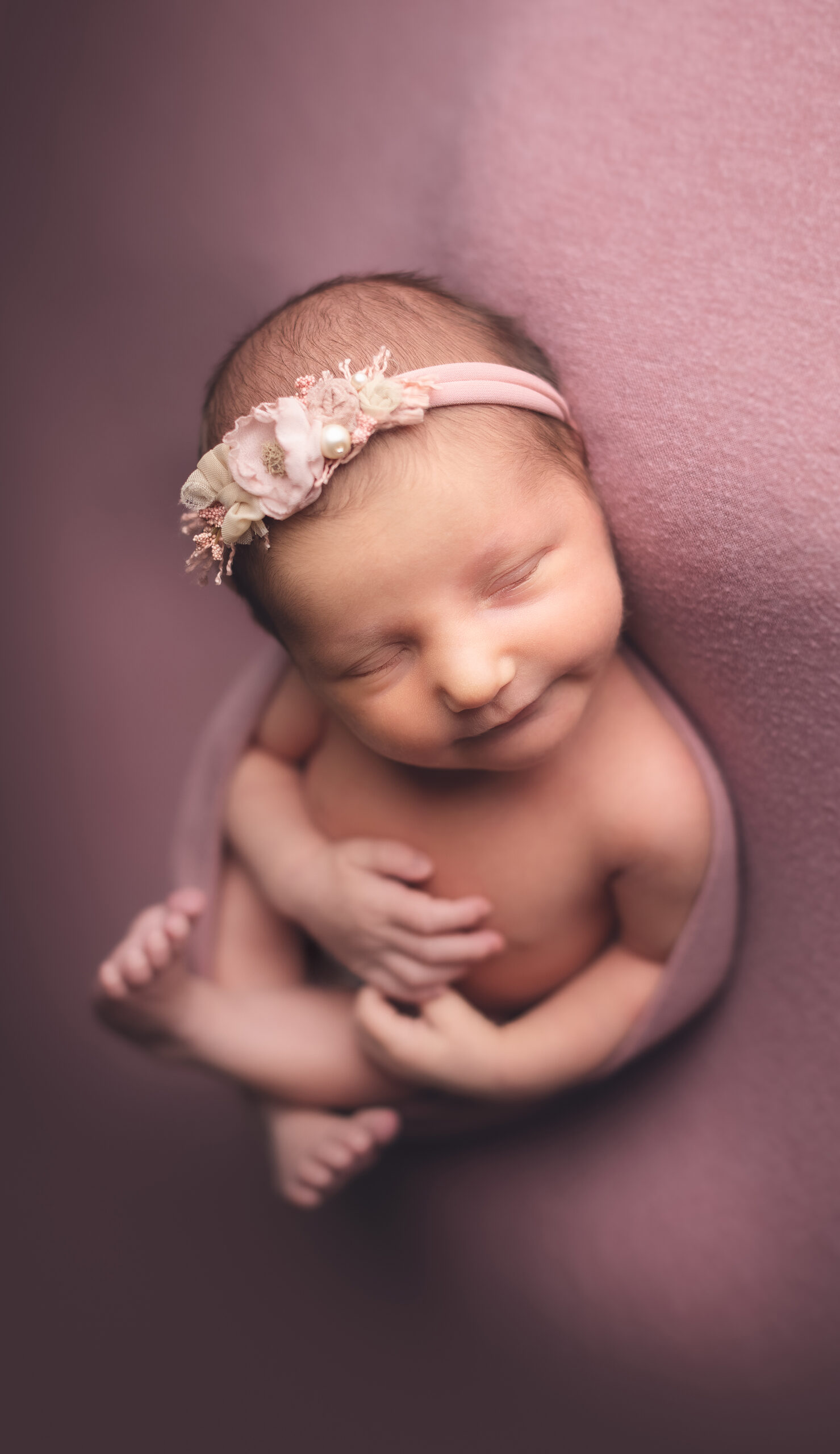 best newborn photography studio - vancouver - burnaby - surrey - girl smiling pink